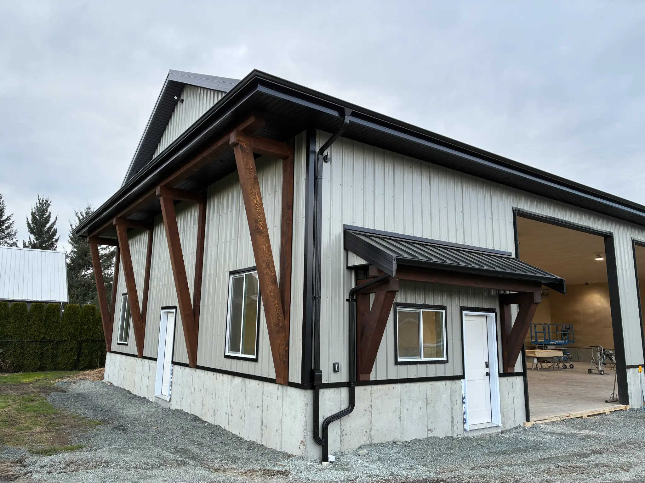 Commercial building corner with seamless gutters and downspouts