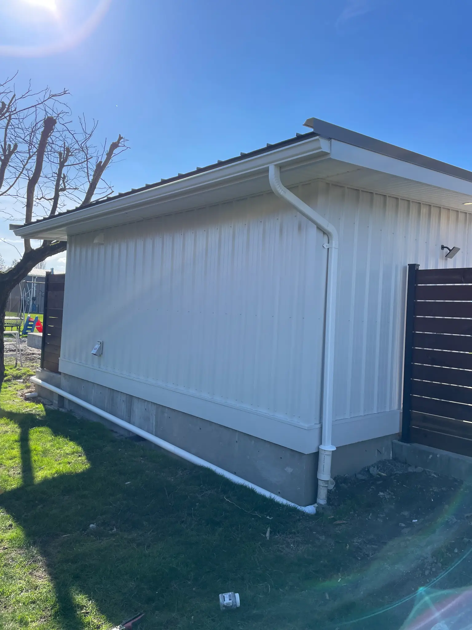 Seamless gutter installation on residential home