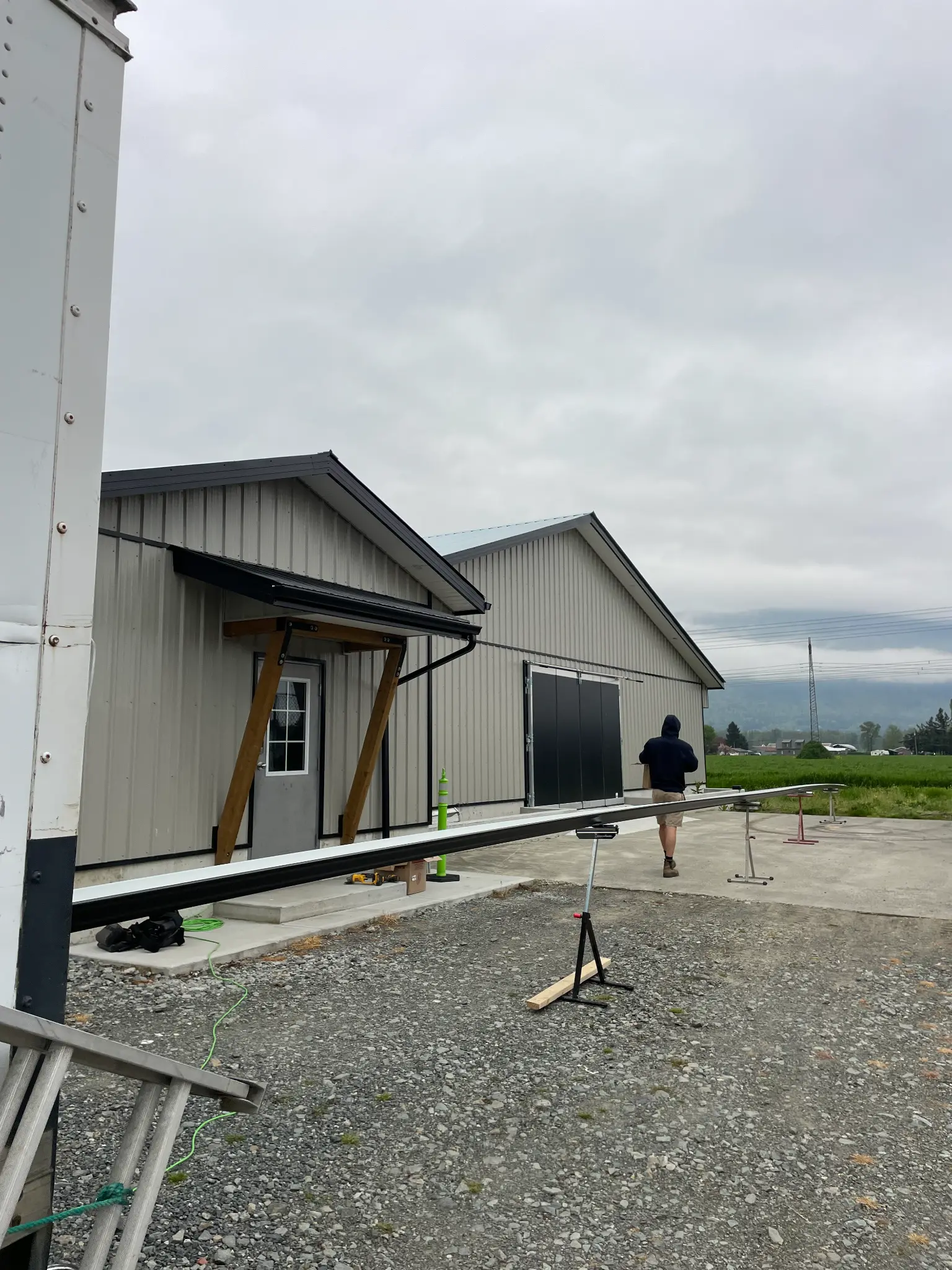 Seamless gutter installation on building exterior