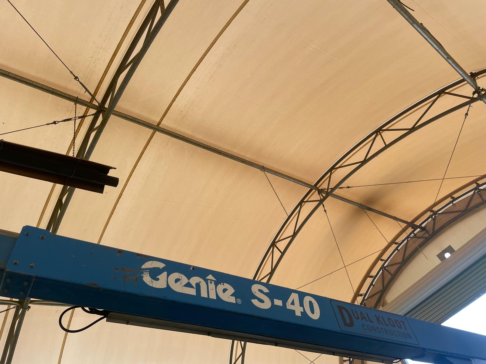 Interior of fabric building with boom lift